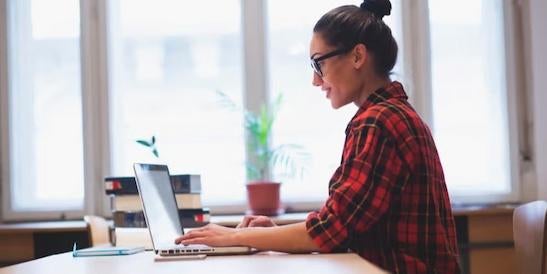 A professional using her laptop