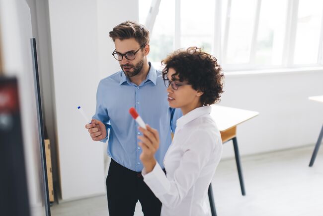 Two business professionals engage in discussion