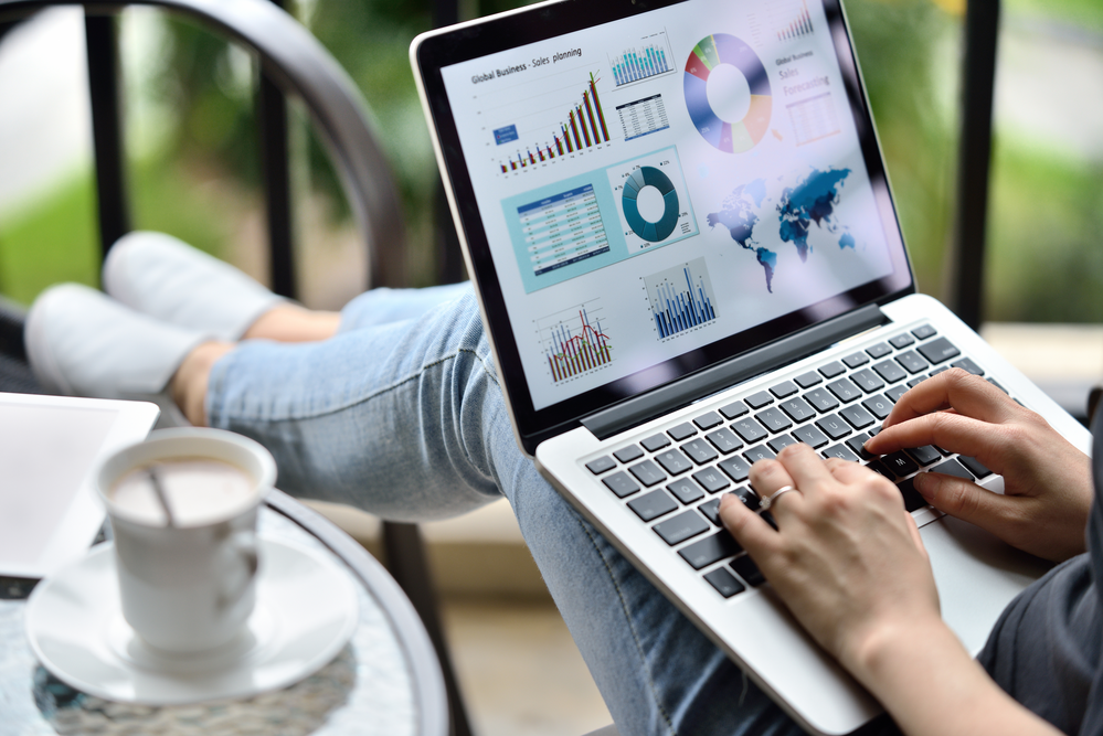 A marketer looking at sales targets and figures on a laptop screen