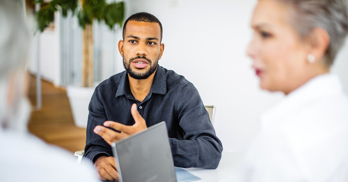 Three people discussing and finding out how to keep up with marketing trends