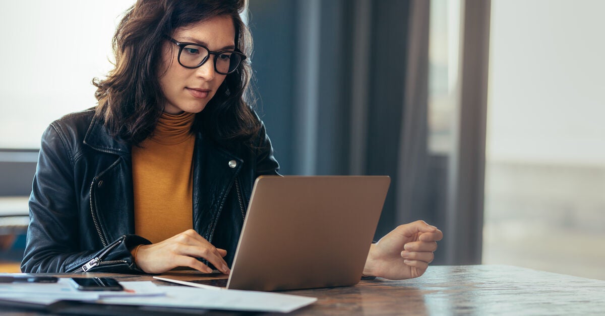 Woman at a laptop learning about why leadership is important in project management