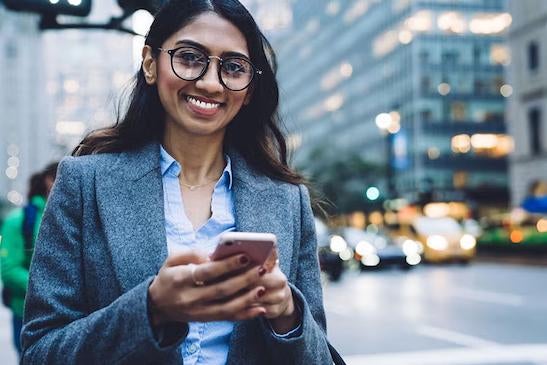 A business professional using her phone