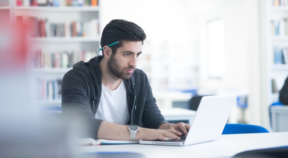 Man studying his MBA on his laptop.