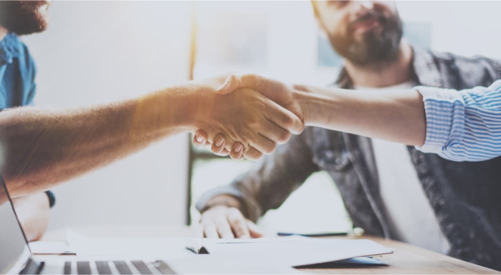 Business partnership handshake concept.Photo two coworkers handshaking process.Successful deal after great meeting